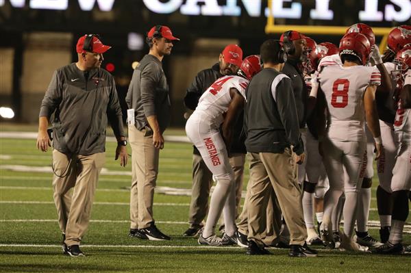 Team huddled on field