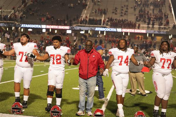 Dr. Coleman in Victory Line with Players