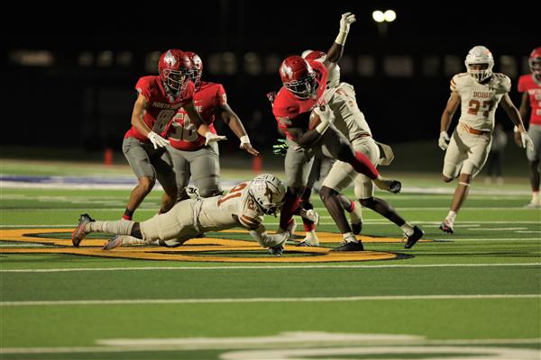 Dobie trying to stop North Shore on the field