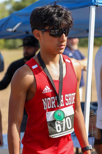 Male runner with medal